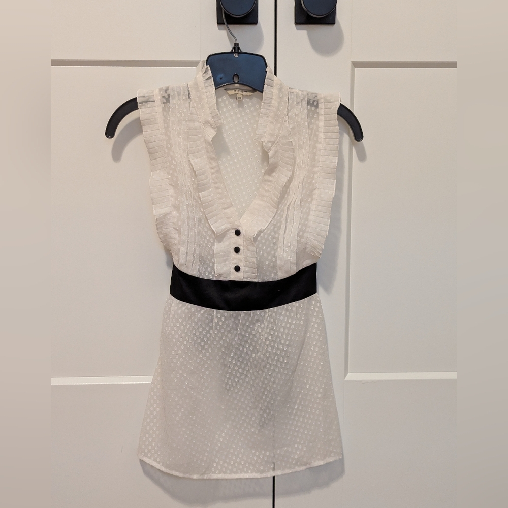 Elegant White Sleeveless Blouse with Black Accents
